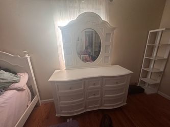 White twin bed and dresser