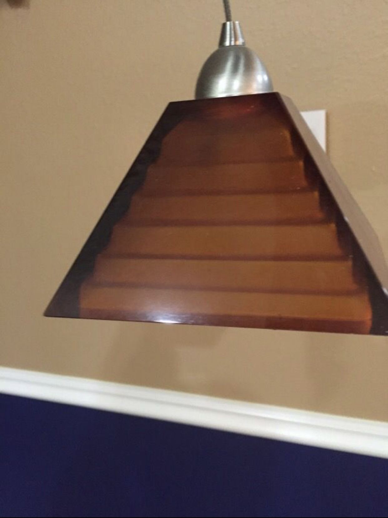 A pair of Tech lighting pyramid pendant lights