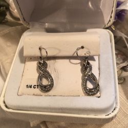 1/4 CTTW diamond .925 Silver Earrings $89.99 Retails at $275.00.