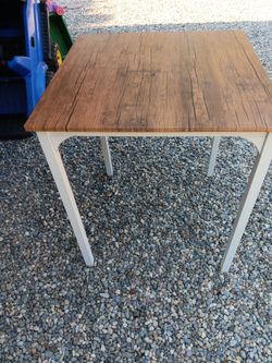 Solid wood/metal dinning table with 2 chairs.