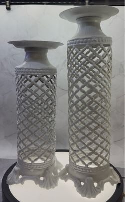 Set of (2) Vintage-style large metal candlestick holders featuring a distressed off white finish. For indoor/Outdoor use. Great for photo shoots & wed