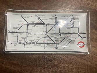 This is a glass trinket dish featuring a map of the London Underground system  Used, good condition