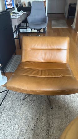Camel swivel leather chair