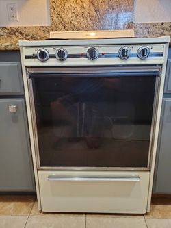 kenmore 24 inch electric range and hood.