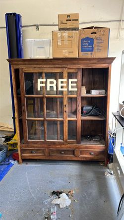 Wooden cabinet with sliding glass doors