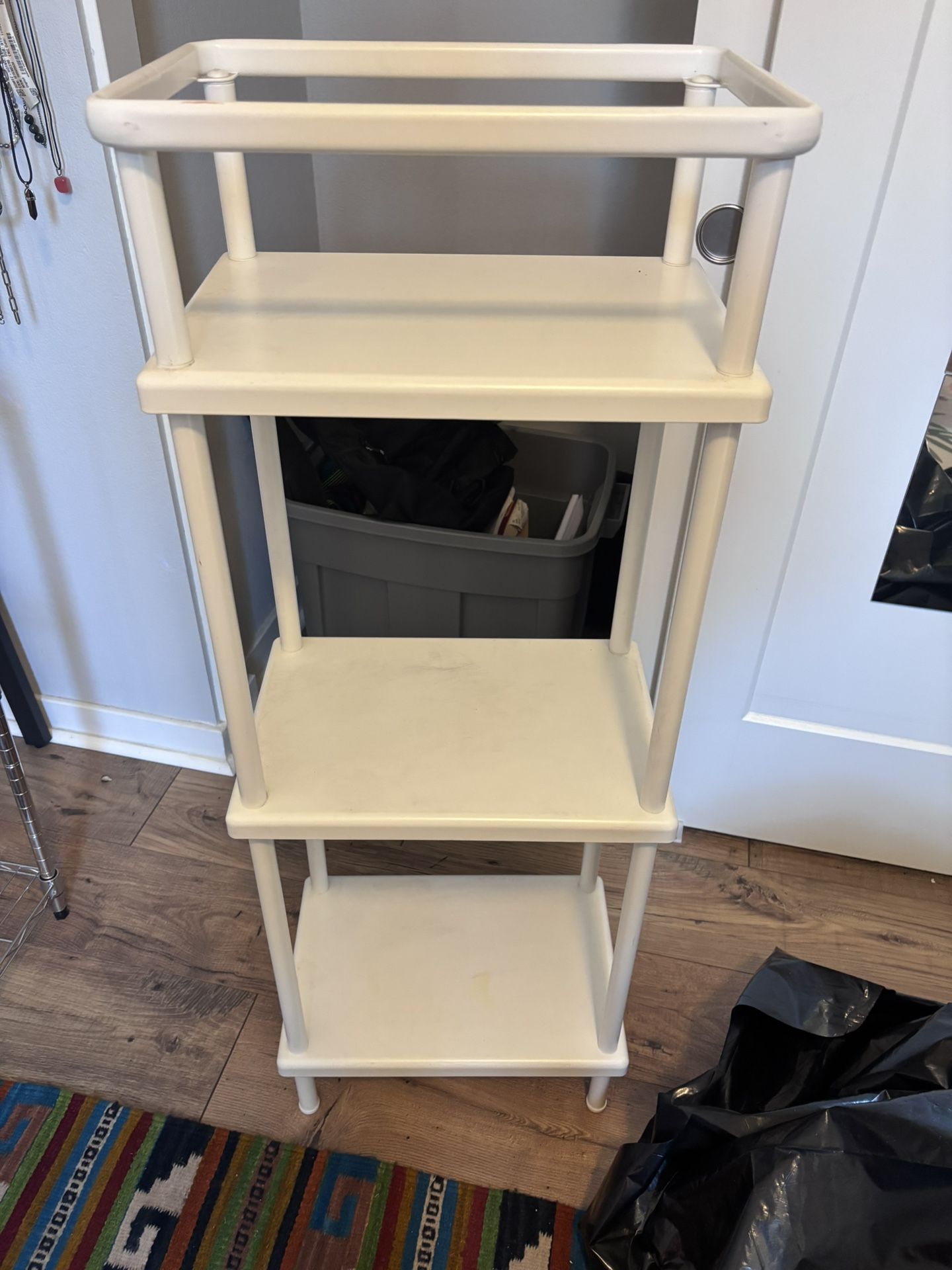 Small white metal shelf