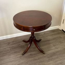 Vintage mcm mahogany single drawer drum table with brass claw feet  Some scratches on top not readily visible until you look at the top from a sideway