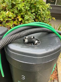 Set of 3 used rain barrels