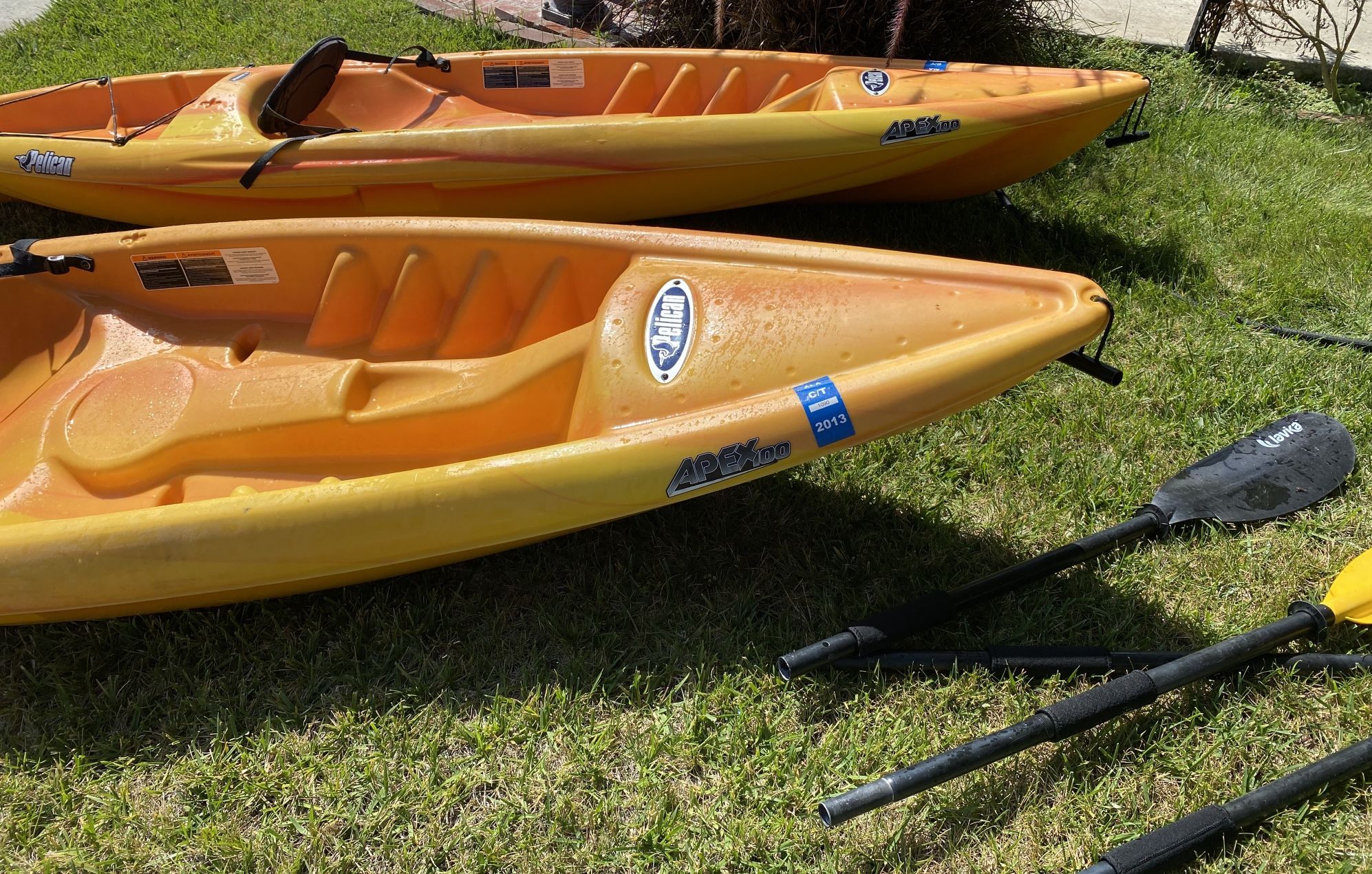 2 Pelican Apex 100 Kayaks, 2 oars, and 2 car racks
