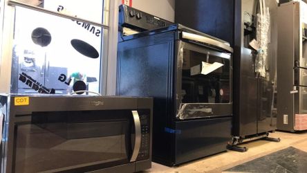 Black stainless steel whirlpool refrigerato,microwave,stove