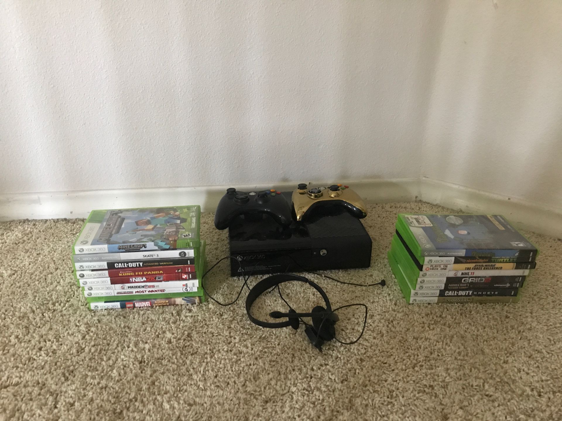 Xbox 360 E. COMES WITH CABLES. 2 controllers, headset, and 18 games