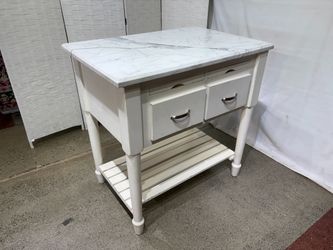 White Stone Top Kitchen Island with Storage and Pull Out Board