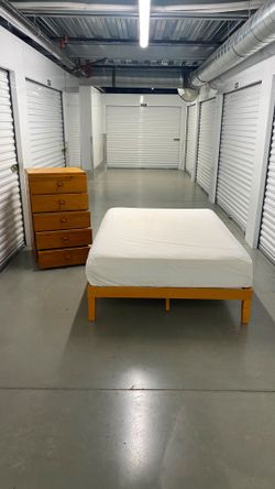 Full size bed frame with mattress and dresser