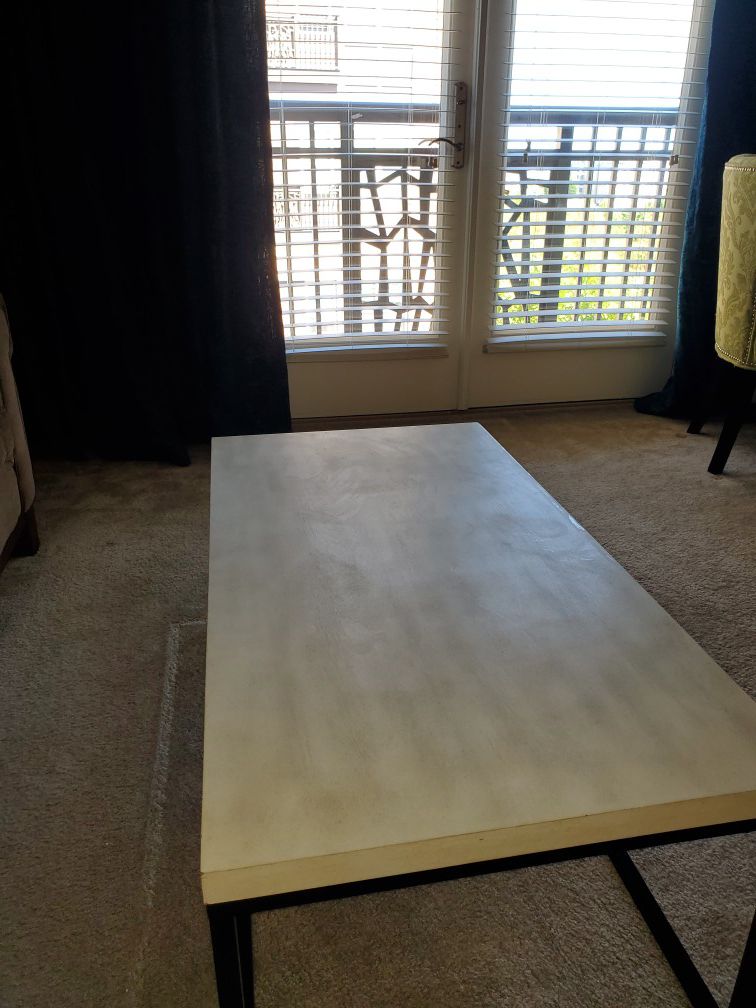 Coffee table with metal frame