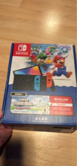 Nintendo switch OLED Mario wonder edition inbox (not new) one of my friends with docking station, charger and hdmi   no trade cash only see my other l