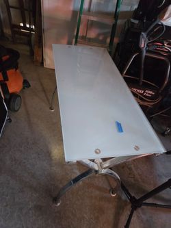 Glass Desk with some scratches on it
