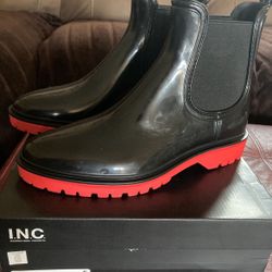 Black Rylein rain boots with red sole by INC. Size 10.