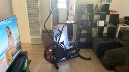Marcy exercises bike