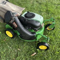 John Deere zero turn lawn mower, gas powered lawn mower.