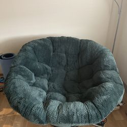 Papasan basket chair with green faux fur cushion