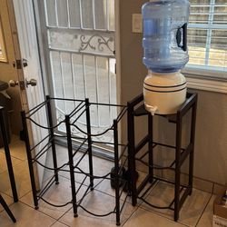 Water tower with gallon holders