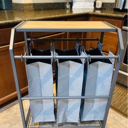 Brand new laundry cart with folding table. $40. Price is firm. :) Higley and ray. 