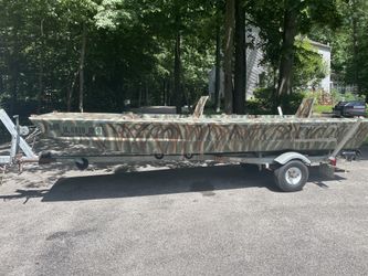 Fishing and hunting boat, motor and trailer