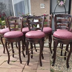 7 Vintage Wood Swiveling Barstools. 