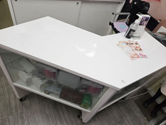Glass Display Cabinet with white top and wheels