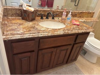 Newly refaced bathroom vanity with granite top