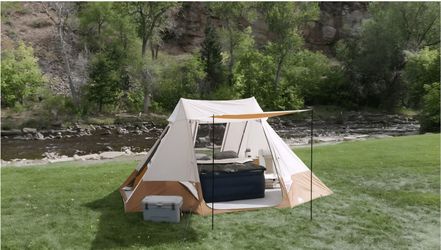 This is an Ozark Trail 10-Person Glamping Ridge Tent with Awning, (se hable español)