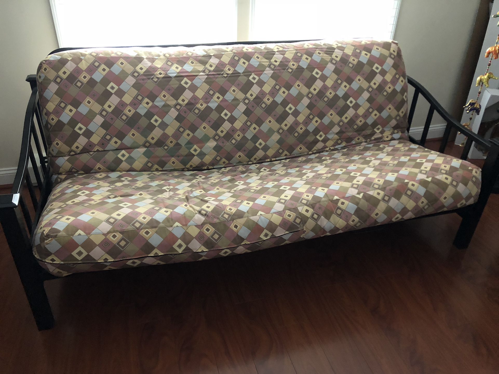 Futon With Black Metal Frame and Funky Patterned Futon Mattress