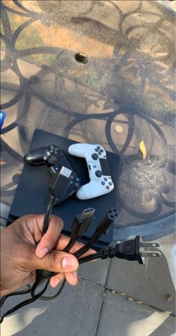 PS4 Slim 1TB with 7 Games and 2 Controllers – Ready to Play
