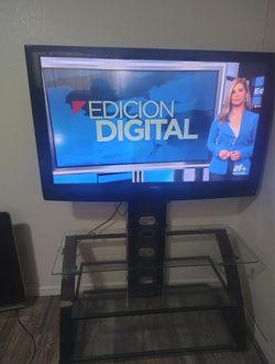 55 inch tv With glass Stand 150.00$ ( O.B.O )