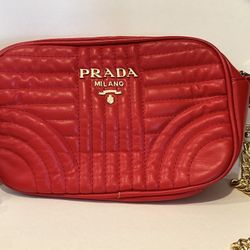 RED PURSE WITH GOLD ACCENTS