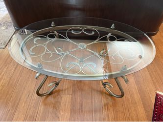 Oval glass and metal coffee table.