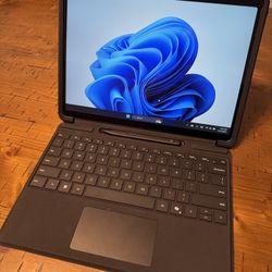 Microsoft Surface Pro 11 13" Black with keyboard, pen, and case.