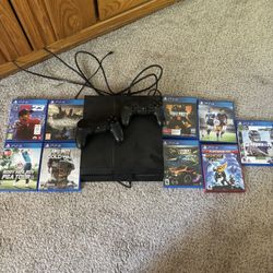 PlayStation 4 With Games And Two Controllers