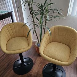 Pair Of Yellow Swivel Chairs