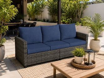 Outdoor Patio Sofa with Blue Cushions.