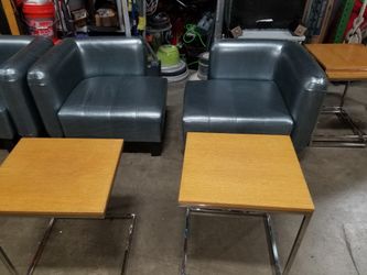 Hotel style lobby chairs and side tables.
