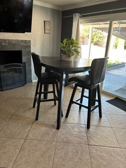 Black diamond shaped high top dining set