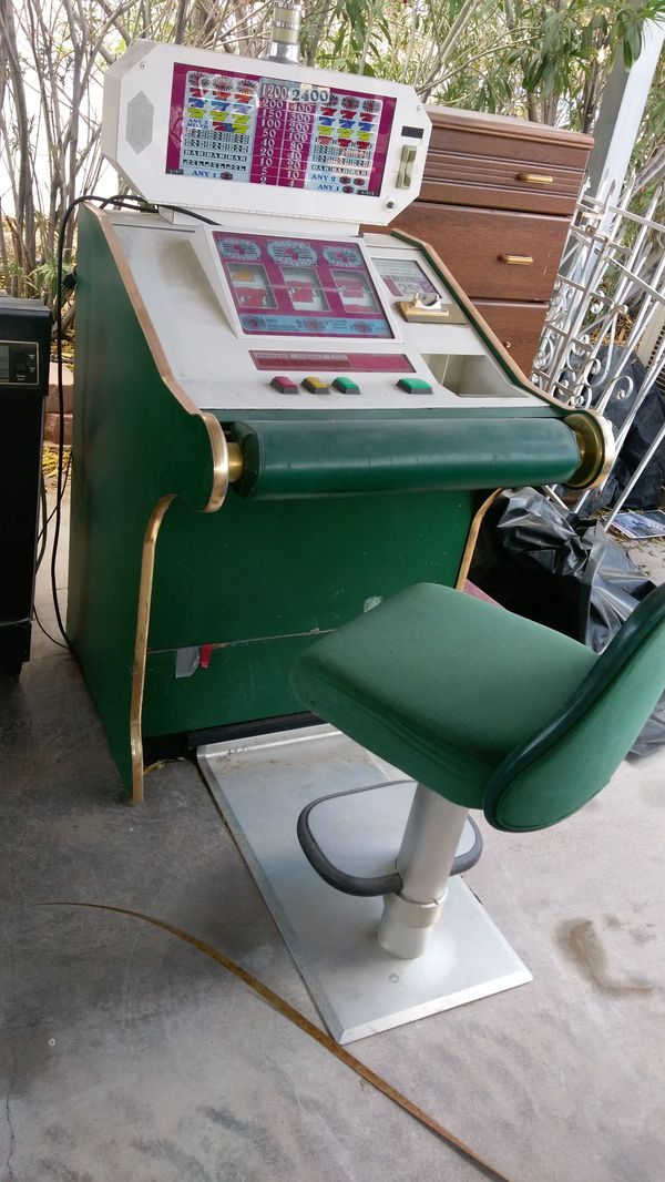 Slot machine & chair . Great conversation piece or decorator item