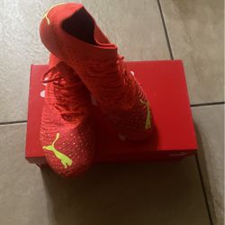 Orange Puma Cleats size 7.5