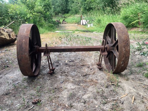 Antique cast iron wagon/tractor wheels and axle for Sale in Portland
