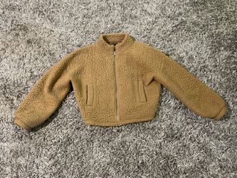 Adorable women’s Express size small tan fleece short jacket.