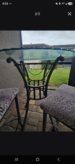 Hight top glass table with 2 matching chairs