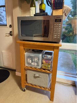 Microwave and wooden cart