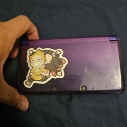 purple 3ds with games and a case