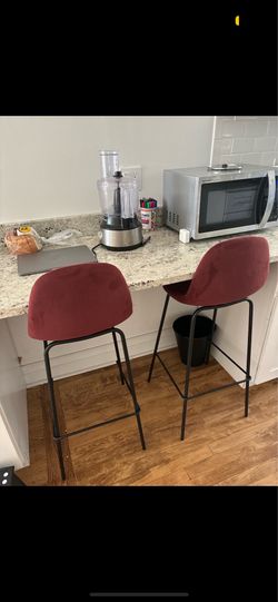 two red bar stools